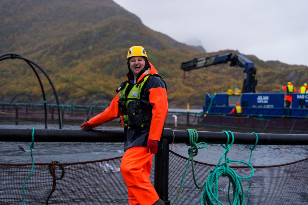 A view from inside the company office showing a boat on the water